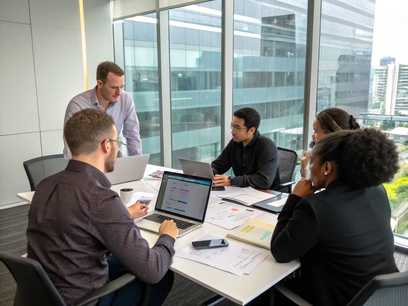 A diverse team of fintech professionals collaborating on a payment solution design, emphasizing the collaborative and innovative approach of Alacrlti.com.
